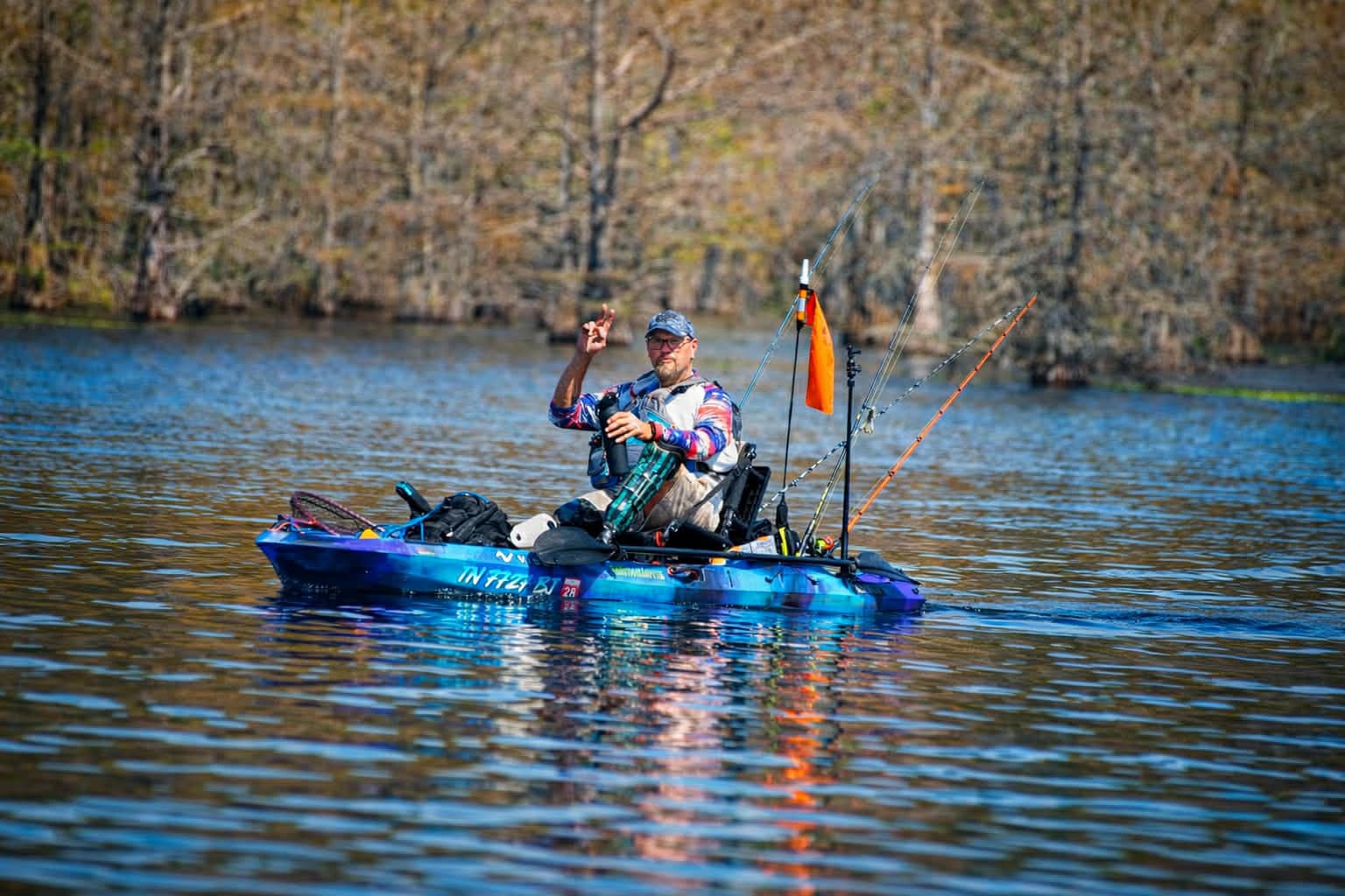 Kayak on a lake with American flag - The Outdoor Amputee